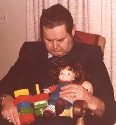Papa Wally snoozing - toys from granddaughter Jill - April 1978